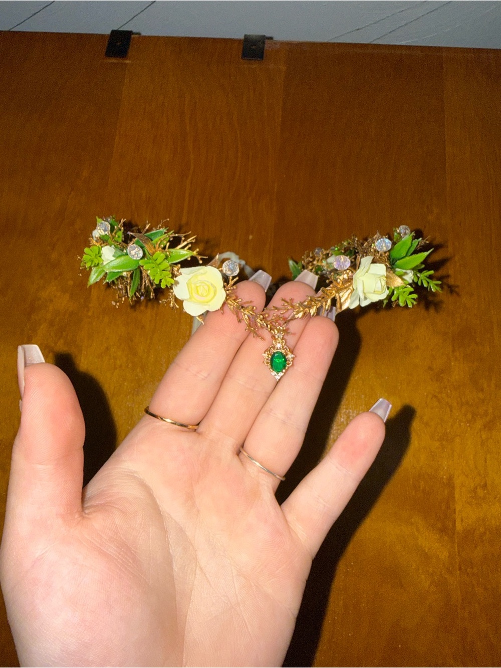Faux flower crown with green gem